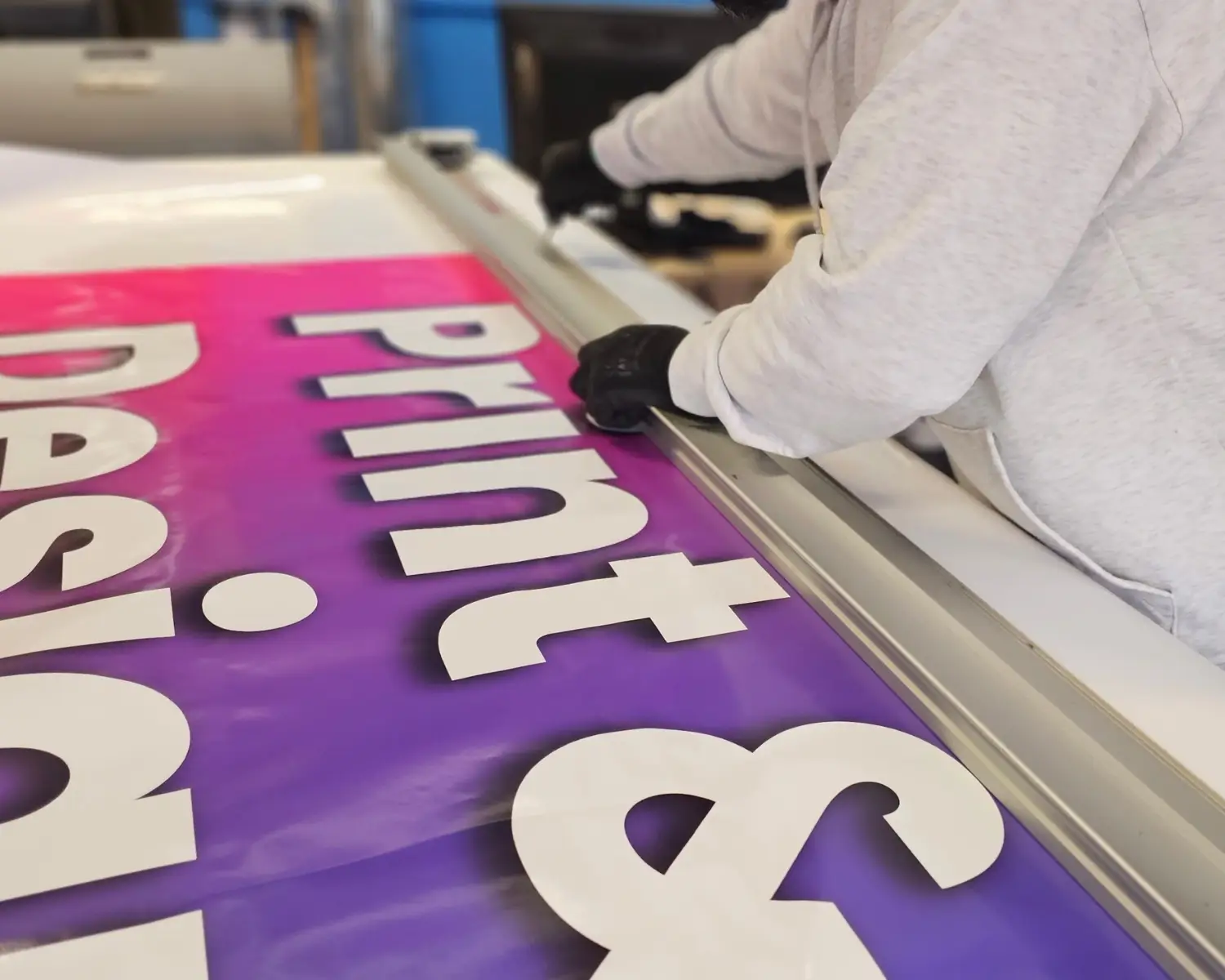 Large cut vinyl lettering being trimmed by hand at Printpal London