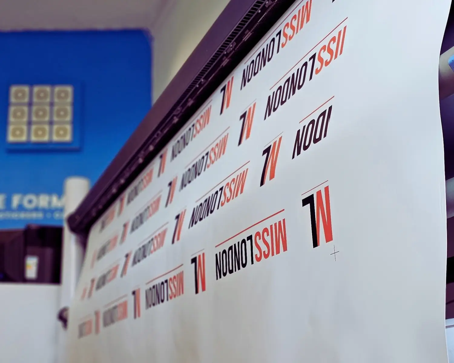 Miss London step-and-repeat backdrop printing on a large-format printer at Printpal London